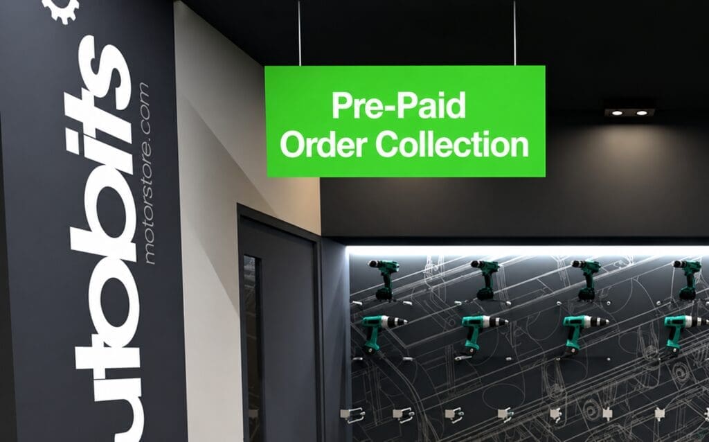 Interior of a modern tool store with a large “Pre-Paid Order Collection” sign hanging above a display of green power drills on a wall, branded “tools motorsstore.com”.